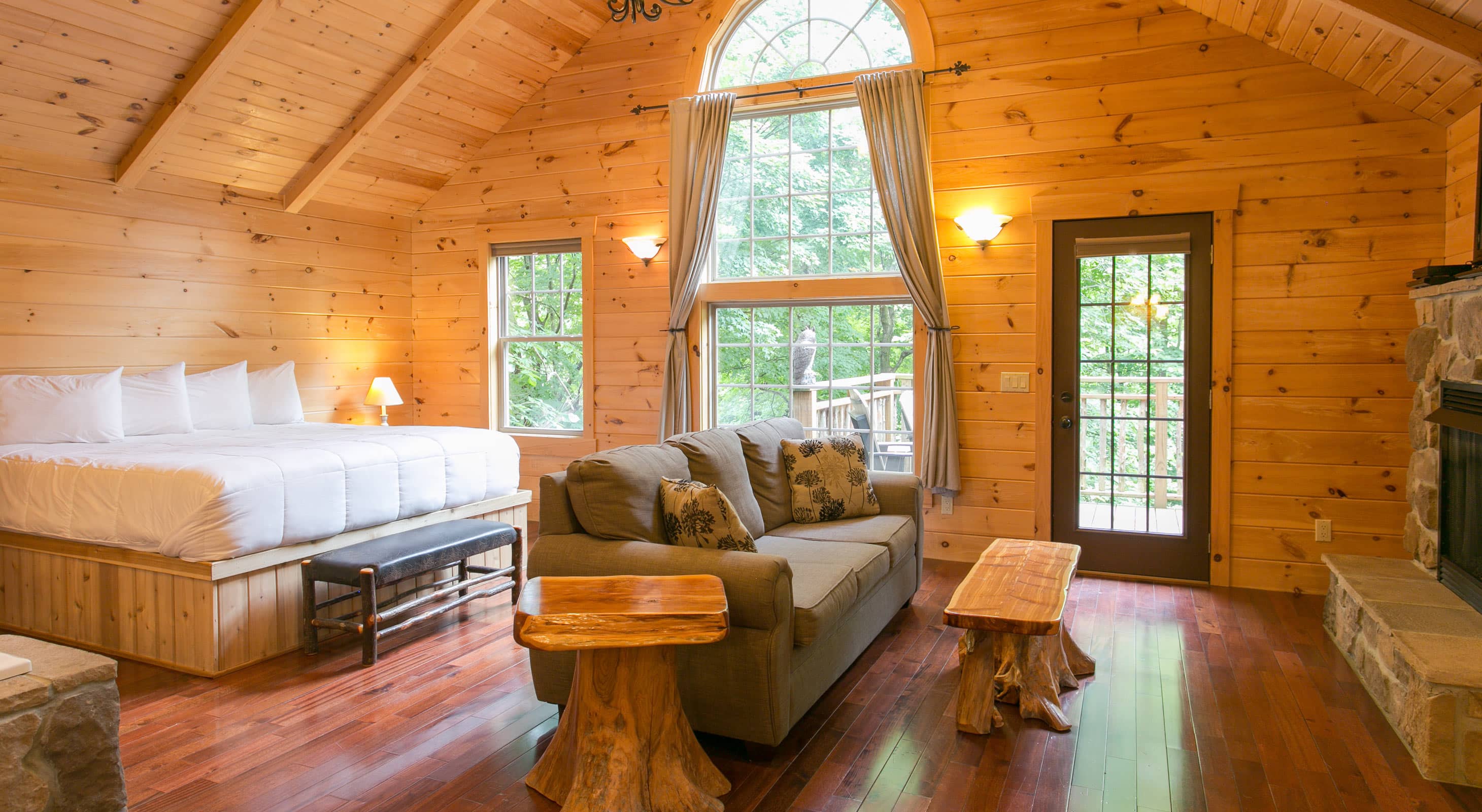 Warm Pine Cove interior with fireplace and romantic lighting